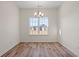 Empty dining room with wood flooring and a window overlooking the front yard at 299 Hayloft Circle, Conway, SC 29526