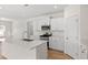 Kitchen featuring a center island, stainless steel appliances, quartz countertops, and white cabinetry at 299 Hayloft Circle, Conway, SC 29526