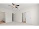 Main bedroom with ceiling fan and ensuite bath featuring a double vanity at 299 Hayloft Circle, Conway, SC 29526