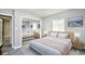 Bedroom with mirrored closet doors and neutral bedding at 872 Jackson Circle, Conway, SC 29526