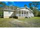 House exterior with a spacious porch and surrounding landscape at 872 Jackson Circle, Conway, SC 29526