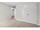 Bright bedroom with neutral walls and carpet flooring, including a double-door closet at 902 Owls Nest Dr., Conway, SC 29527