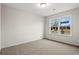 Bright bedroom with neutral walls and carpet flooring, featuring a large window at 902 Owls Nest Dr., Conway, SC 29527