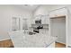 Modern kitchen with white cabinets, granite countertops and a large island at 902 Owls Nest Dr., Conway, SC 29527