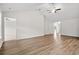 Open living room with vaulted ceilings, hardwood flooring, and a ceiling fan at 902 Owls Nest Dr., Conway, SC 29527