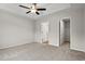 Main bedroom with carpet, ceiling fan and ensuite bathroom at 902 Owls Nest Dr., Conway, SC 29527