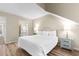 Well-lit bedroom with a queen bed and an ensuite bathroom at 175 Saint Clears Way # 23-I, Myrtle Beach, SC 29572