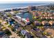 Aerial view of condo community on a lake with pool, surrounded by scenic views and close to the beach at 1919 Spring St. # B-16, North Myrtle Beach, SC 29582