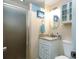Bathroom featuring stylish vanity, framed mirror, and glass enclosed shower at 1919 Spring St. # B-16, North Myrtle Beach, SC 29582