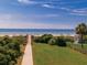 Scenic beach access with boardwalk and lush greenery, leading to the beautiful ocean and sandy shores at 1919 Spring St. # B-16, North Myrtle Beach, SC 29582