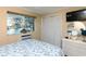 Cozy bedroom featuring large window with peaceful waterfront view at 1919 Spring St. # B-16, North Myrtle Beach, SC 29582