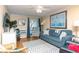 Bright living room with comfortable seating, ceiling fan, and access to the outdoors at 1919 Spring St. # B-16, North Myrtle Beach, SC 29582