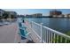 Waterfront outdoor gathering area with lounge chairs and white railing offering picturesque community views at 1919 Spring St. # B-16, North Myrtle Beach, SC 29582
