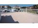 Community outdoor gathering area with picnic tables, barbecue grill, and white railing, perfect for social events at 1919 Spring St. # B-16, North Myrtle Beach, SC 29582