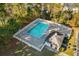 Aerial view of a pool with clubhouse surrounded by trees at 2169 Wedgewood Dr., Longs, SC 29568