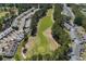 This aerial view shows a golf course surrounded by residential properties in a serene community at 2169 Wedgewood Dr., Longs, SC 29568