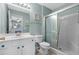 Bright bathroom with a white vanity, toilet, and glass-enclosed shower at 2169 Wedgewood Dr., Longs, SC 29568