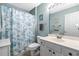 Bright bathroom featuring a single vanity and a shower with a patterned curtain at 2169 Wedgewood Dr., Longs, SC 29568