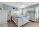 Comfortable main bedroom with white furniture and ceiling fan at 2169 Wedgewood Dr., Longs, SC 29568