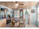 Cozy dining area featuring wood ceiling, four chairs, and an electric fireplace at 2169 Wedgewood Dr., Longs, SC 29568