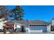 Charming single-story home with an attached garage and well-maintained lawn under a clear blue sky at 2169 Wedgewood Dr., Longs, SC 29568