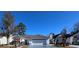 View of single story home with garage, well-kept lawn and landscaping on a clear day at 2169 Wedgewood Dr., Longs, SC 29568