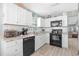 Well-lit kitchen with white cabinets, black appliances, granite countertops, and white subway tile backsplash at 2169 Wedgewood Dr., Longs, SC 29568