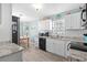 Modern kitchen featuring white cabinets, granite countertops and black appliances at 2169 Wedgewood Dr., Longs, SC 29568