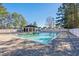 Community pool with a brick surround and adjacent cabana at 2169 Wedgewood Dr., Longs, SC 29568