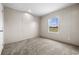 Simple bedroom with carpeted floor and a window at 218 Eva Dr., Loris, SC 29569