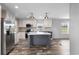 Open concept kitchen with island and stainless steel appliances at 218 Eva Dr., Loris, SC 29569