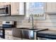 Farmhouse-style kitchen sink with a modern faucet at 218 Eva Dr., Loris, SC 29569