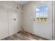 Laundry room with built-in shelving and exterior access at 218 Eva Dr., Loris, SC 29569