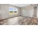 Living room with wood-look floors and accent wall at 218 Eva Dr., Loris, SC 29569