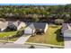 Aerial view of home in a quiet neighborhood with well maintained lawns and mature trees at 4659 East Walkerton Rd., Myrtle Beach, SC 29579