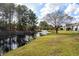 A pond view from the backyard with a water feature in the background at 4659 East Walkerton Rd., Myrtle Beach, SC 29579