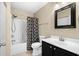 Well-maintained bathroom with a shower-tub combo and a black vanity sink at 4659 East Walkerton Rd., Myrtle Beach, SC 29579