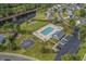 Aerial view of community amenities, including a pool, playground, basketball court, and picnic area at 4659 East Walkerton Rd., Myrtle Beach, SC 29579