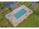 Aerial view of a community pool, basketball court, lounge chairs, picnic tables, parking and green spaces at 4659 East Walkerton Rd., Myrtle Beach, SC 29579