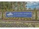 View of the Walkers Woods at Carolina Forest community sign surrounded by landscaping at 4659 East Walkerton Rd., Myrtle Beach, SC 29579