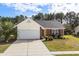 Charming home with a well manicured lawn and mature trees at 4659 East Walkerton Rd., Myrtle Beach, SC 29579
