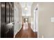 Inviting entryway and hallway showcasing hardwood floors and natural light at 4659 East Walkerton Rd., Myrtle Beach, SC 29579