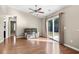 Bright living room featuring wood floors, vaulted ceiling, and sliding glass door to the backyard at 4659 East Walkerton Rd., Myrtle Beach, SC 29579
