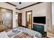 This charming bedroom showcases wood-look floors and a warm, inviting color palette at 7299 Cartrette Rd., Aynor, SC 29511