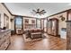 Serene bedroom retreat featuring natural light, rustic decor, and wood-style floors at 7299 Cartrette Rd., Aynor, SC 29511