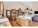Open kitchen with custom wood cabinets, granite countertops, and stainless-steel appliances at 7299 Cartrette Rd., Aynor, SC 29511