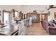 Open-concept living area featuring a kitchen, dining area, stainless steel appliances, and a leather couch at 7299 Cartrette Rd., Aynor, SC 29511