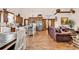 Open living area featuring hard wood floors, stainless steel appliances, dining, and a leather couch at 7299 Cartrette Rd., Aynor, SC 29511