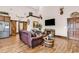 Cozy living room with a leather couch, barrel accents, and mounted deer head decor at 7299 Cartrette Rd., Aynor, SC 29511