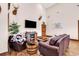 Cozy living room with wood floors, a fireplace, and rustic decor. Perfect for relaxation at 7299 Cartrette Rd., Aynor, SC 29511
